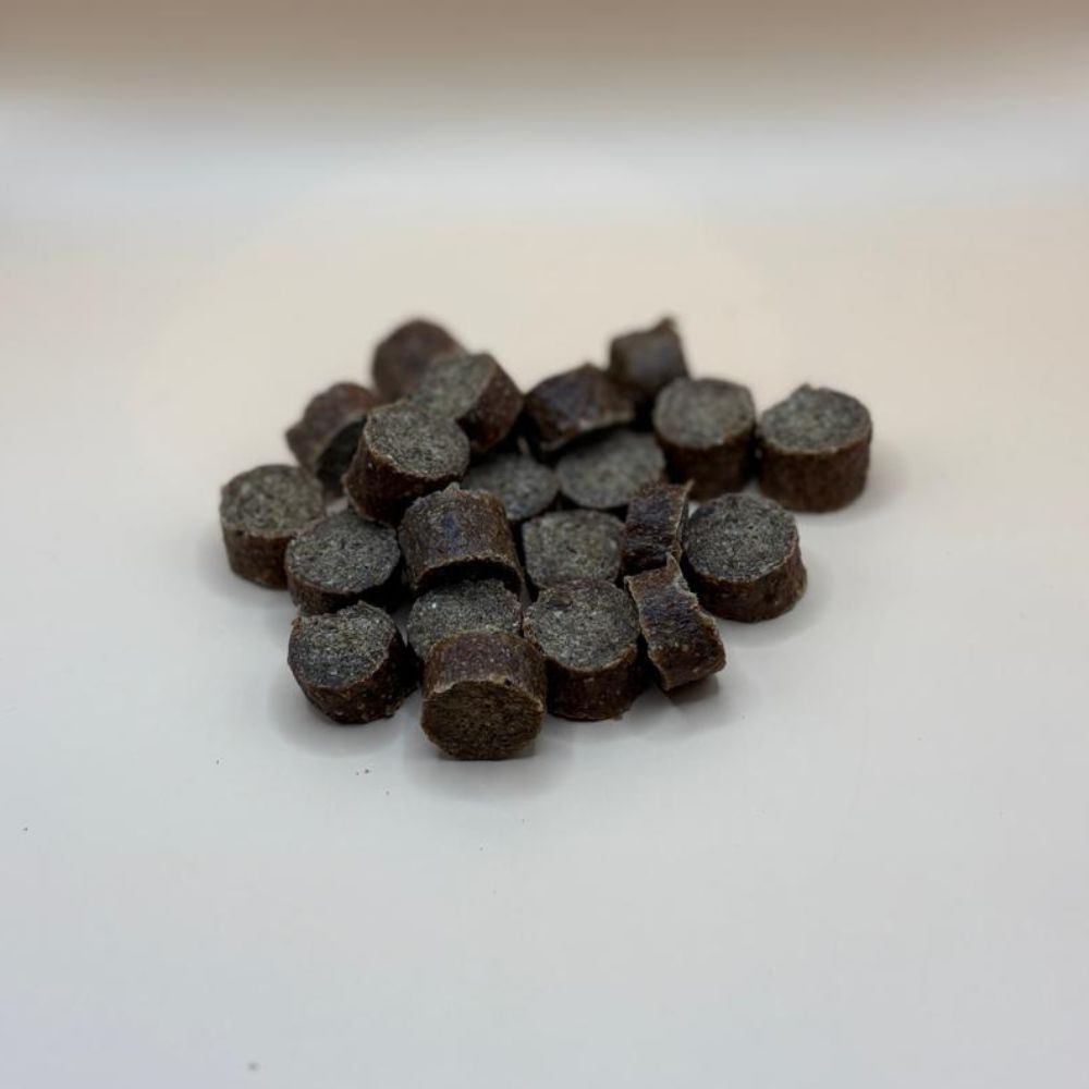 Gourmet bites dog treats on a blank background