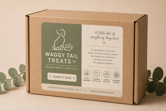 Waggy Tail Treats Co packaging box with eucalyptus leaves on a beige background