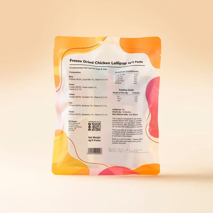 A stand-up pouch of Freeze Dried Chicken Lollipop Air Flakes shown from the back, featuring a white label with black text and orange, pink, and yellow abstract accents, set against a warm beige gradient background.
